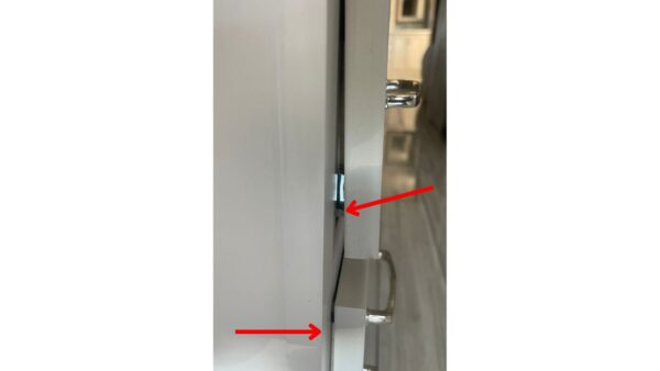 A door to a drawer that has not been adjusted to fit properly