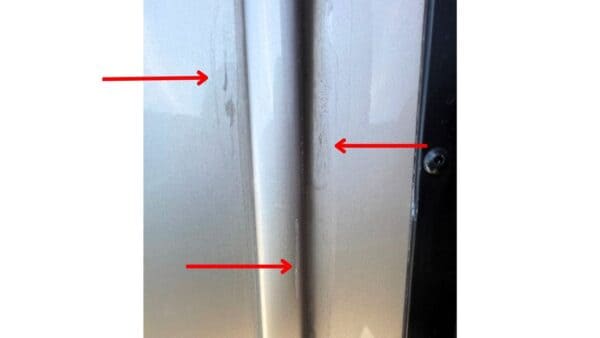 Exterior trim where sealant is sloppy and missing in places