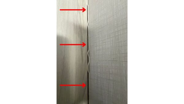 A huge gap in the seam where two walls meet