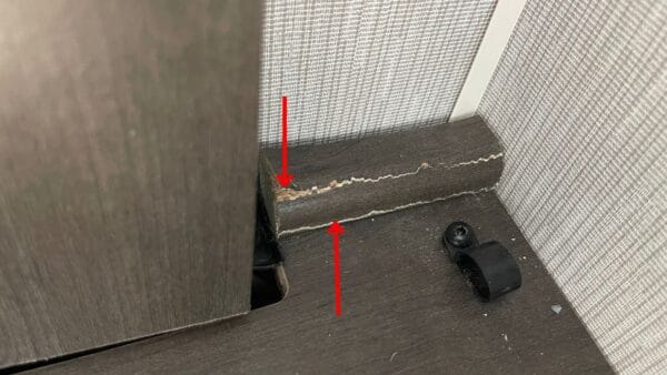 A large floor trim piece that looks like it's water damaged
